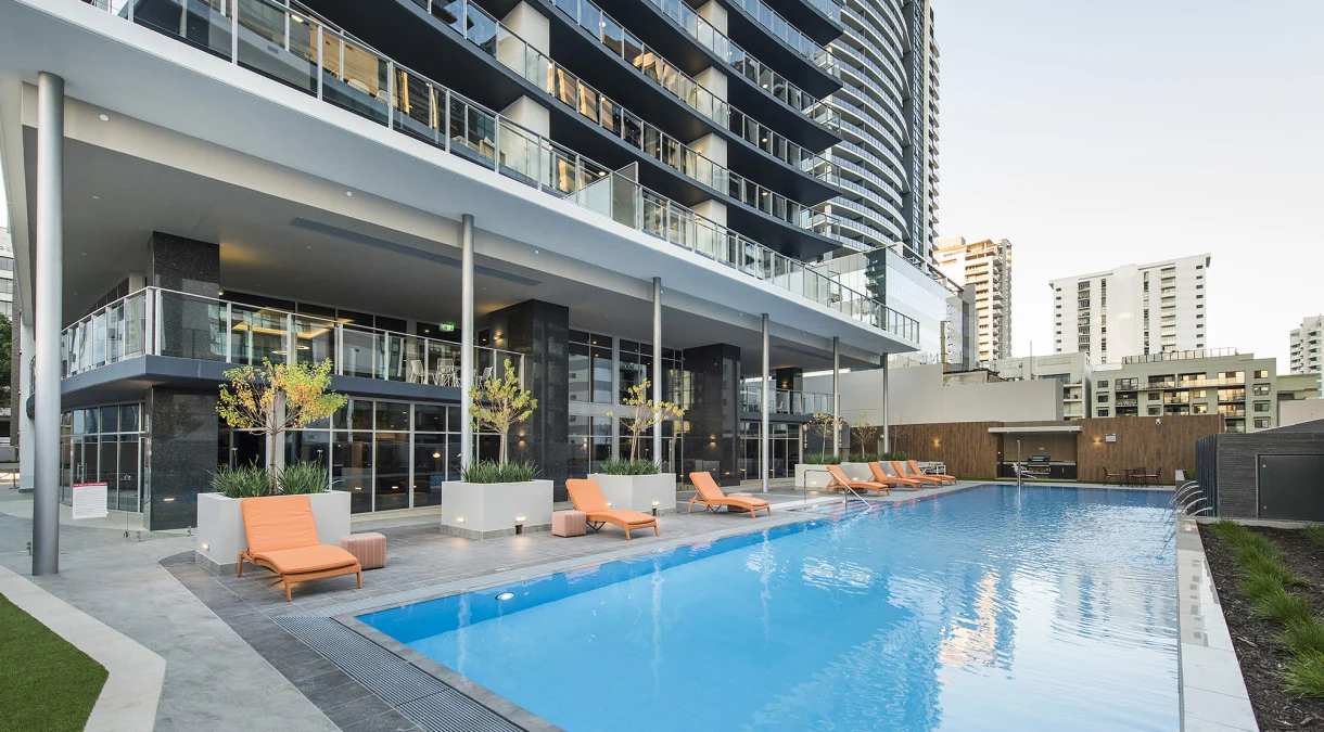 Poolside seating in the Concerto residential community